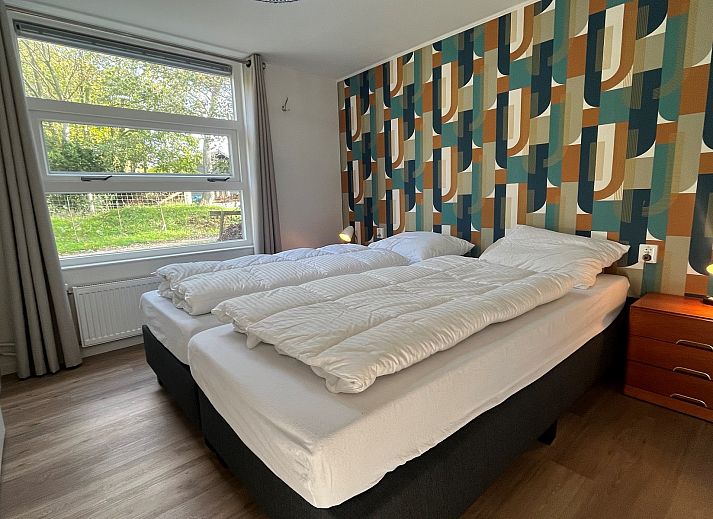 Geniet van het zonnige terras bij Vakantiewoning Het Ongerepte 21 'Kaatje Mossel' in Renesse, Schouwen-Duiveland, een charmant vakantiehuis in Zeeland.