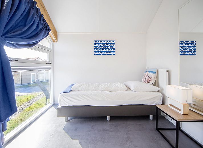 Gruener Garten des Ferienhauses Zonnedorp 12 Jolie in Renesse, Zeeland mit moderner Veranda.