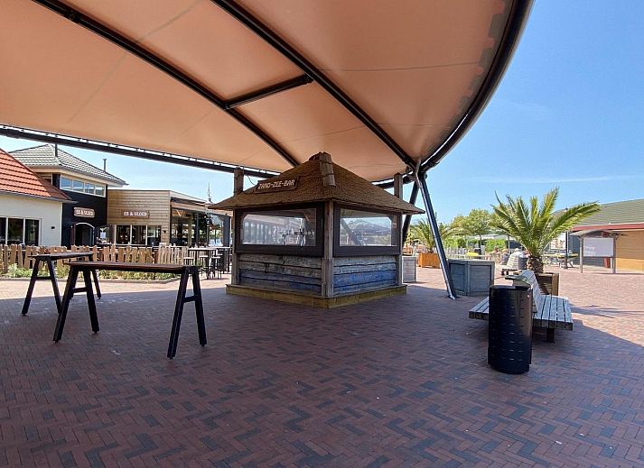 Spacious terrace with comfortable seating at VZ2326 Holiday Chalet Stern 1866 Renesse in Renesse, Schouwen-Duiveland.