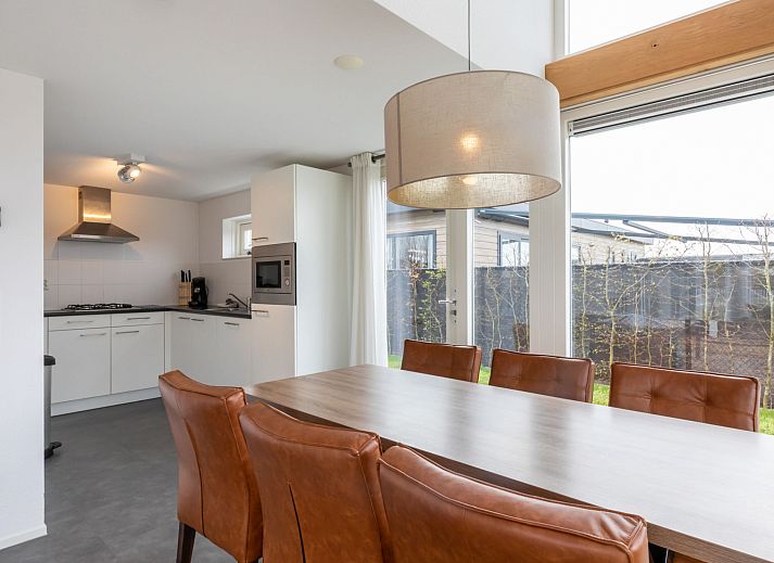 Spacious living room in Holiday home Duinzicht Renesse with modern furnishings and lots of natural light.