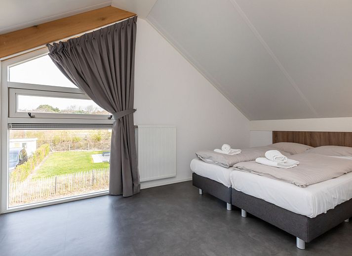 Comfortable bedroom in Holiday home Duinzicht Renesse with en-suite bathroom in Renesse, Zeeland.