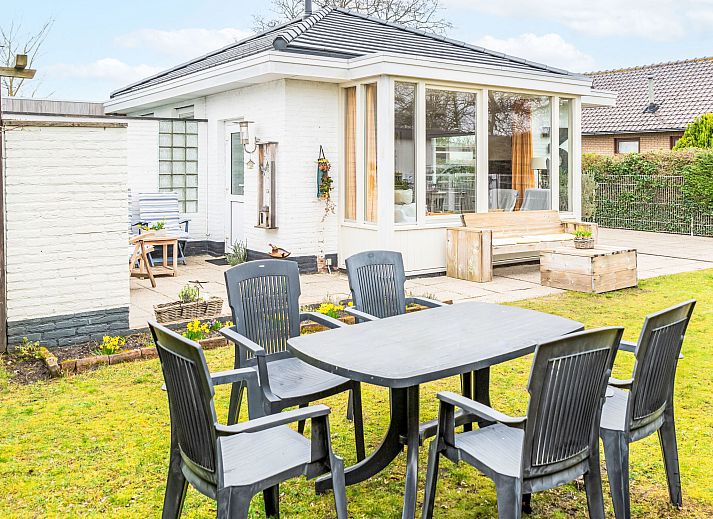 Bright living room in Holiday Home Horizon by the Sea, Renesse, with comfortable seating and views of the garden.
