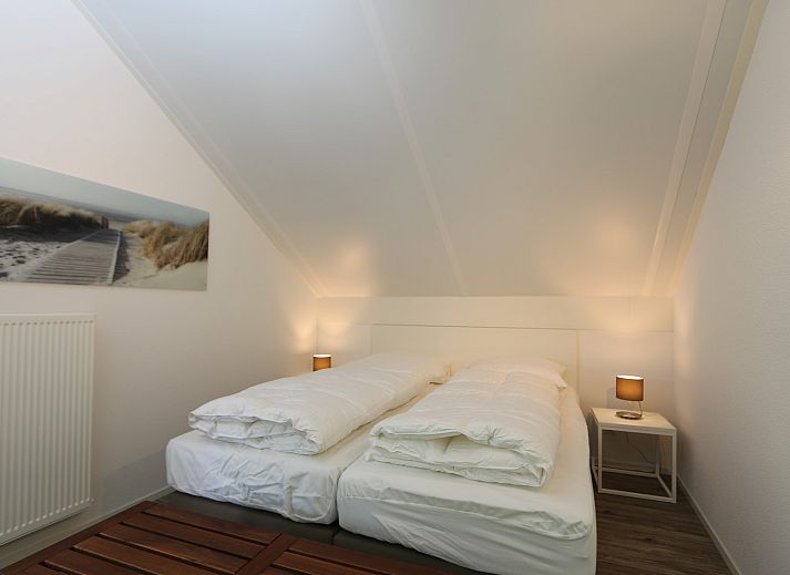 Bright living room of Mon Repos in Renesse with comfortable sofa and modern furnishings