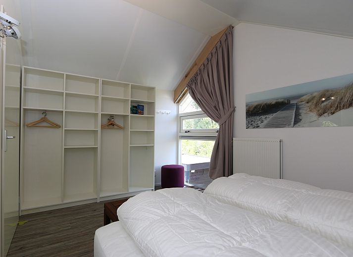 Bright living room of Mon Repos in Renesse with comfortable sofa and modern furnishings