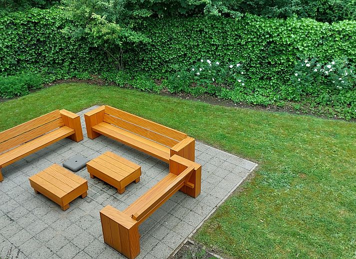 Family house Bremweg 22 in Renesse, a modern vacation home with spacious garden and comfortable outdoor seating.