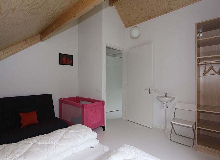 Cozy outdoor area of Family House Bremweg 22 in Renesse, ideal for relaxing in nature.