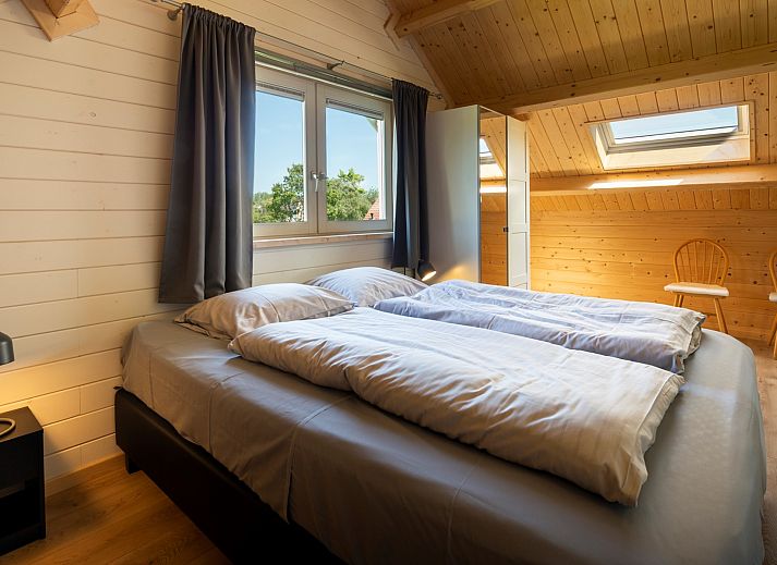 Gemuetliches Wohnzimmer des Ferienhauses Scalde Oort 43 Duinzigt in Westenschouwen, mit komfortabler Sitzecke in Zeeland.