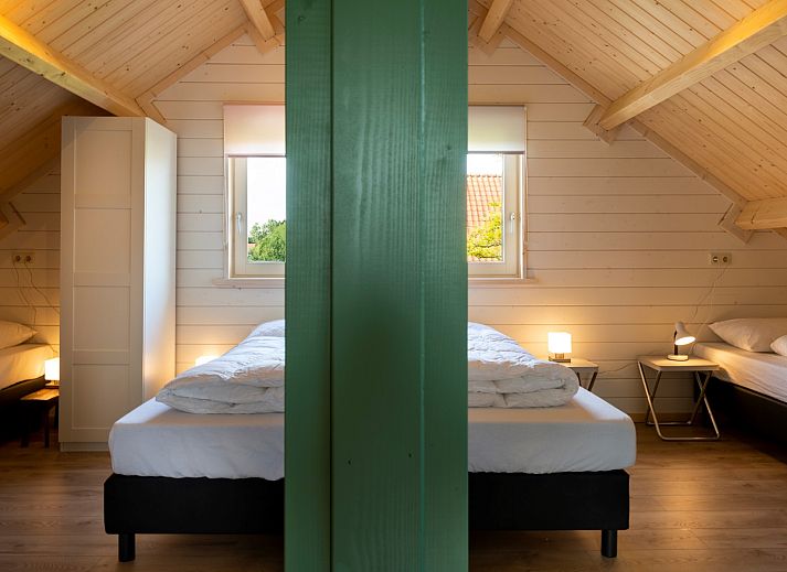 Gemuetliches Wohnzimmer des Ferienhauses Scalde Oort 43 Duinzigt in Westenschouwen, mit komfortabler Sitzecke in Zeeland.