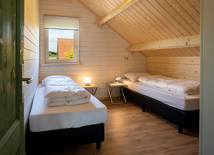 Gemuetliches Wohnzimmer des Ferienhauses Scalde Oort 43 Duinzigt in Westenschouwen, mit komfortabler Sitzecke in Zeeland.