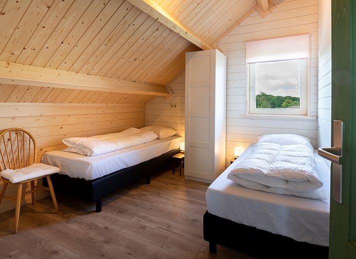 Gemuetliches Wohnzimmer des Ferienhauses Scalde Oort 43 Duinzigt in Westenschouwen, mit komfortabler Sitzecke in Zeeland.