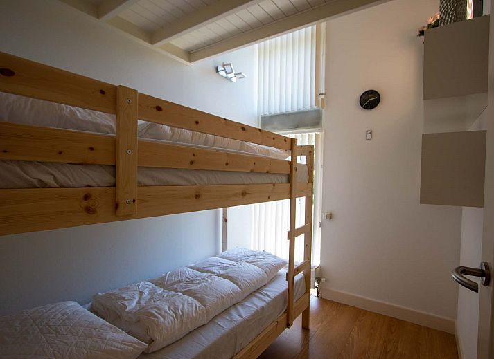 Sunny garden with deck chairs at Holiday home Salvatorhoeve 91 in Ouwerkerk, ideal for a relaxing stay in Zeeland.