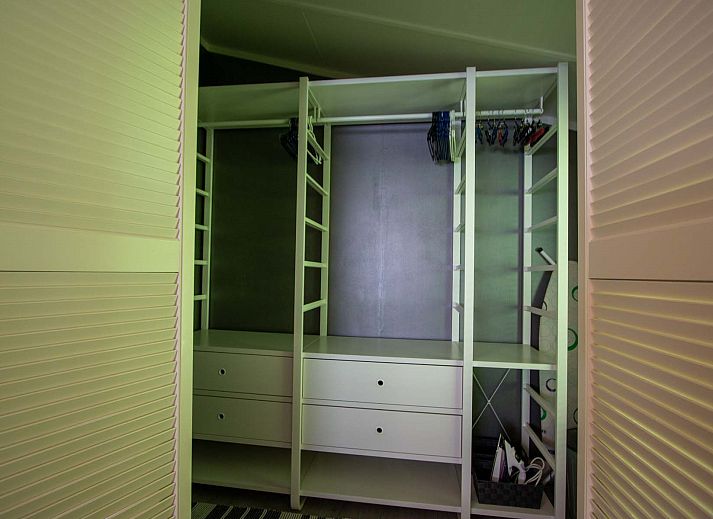 Sunny garden with deck chairs at Holiday home Salvatorhoeve 91 in Ouwerkerk, ideal for a relaxing stay in Zeeland.