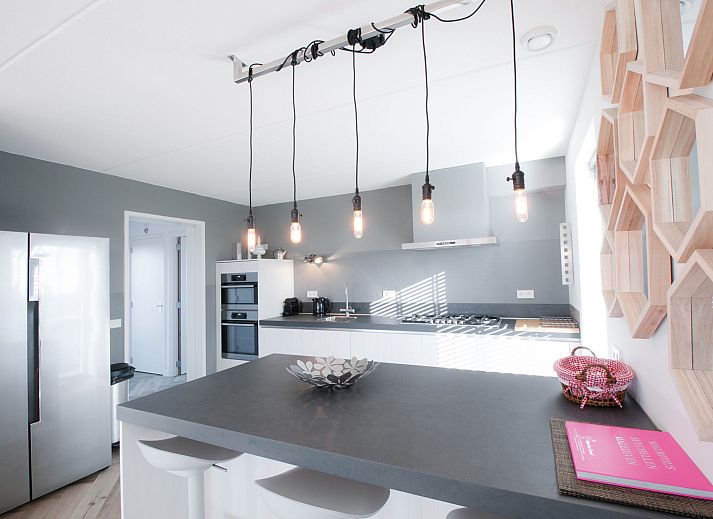 Aerial view of Holiday home Oesterdam Resort in Tholen, Zeeland overlooking the water and green surroundings.