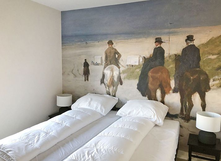 Modern vacation home facade of Oesterdam Resort in Tholen, Zeeland with terrace and seating area.