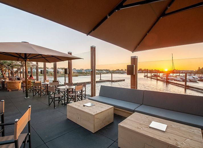 Stylish living room in Holiday home Oesterdam Resort, Tholen, Zeeland with comfortable seating area.