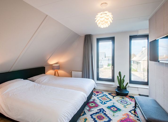 Modern kitchen in Holiday home Oesterdam Resort, Tholen, Zeeland with sleek furnishings and lighting.