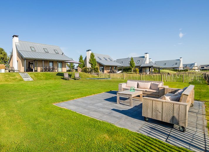 Modern living room in Holiday home Oesterdam Resort, Tholen, with comfortable seating area.