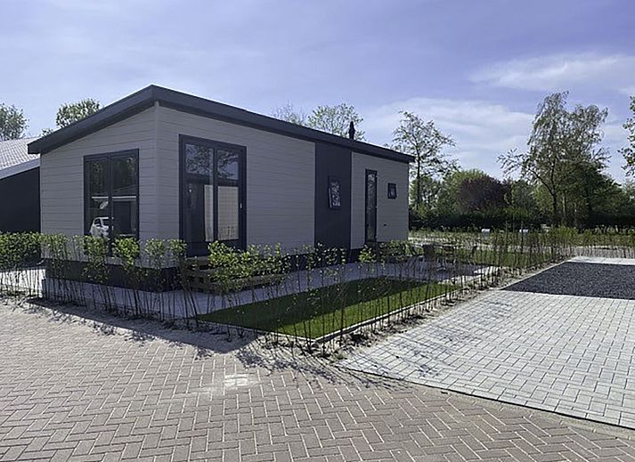 Stijlvolle woonkamer in Vakantiehuis De Noordzee, Scherpenisse, met modern interieur in Zeeland.