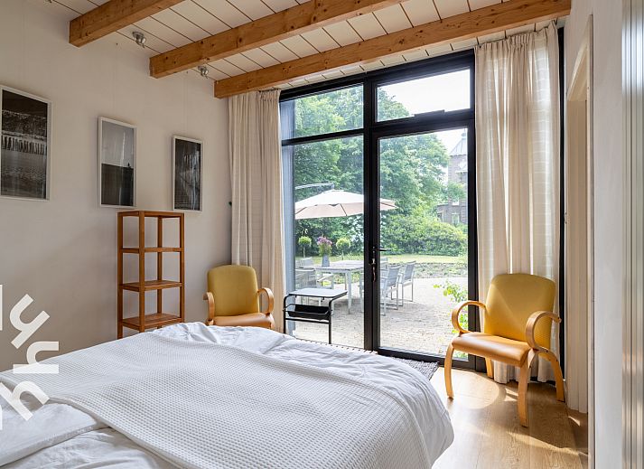 Cozy terrace at vacation home ZE1302 in Koudekerke, surrounded by green nature in Walcheren, Zeeland.