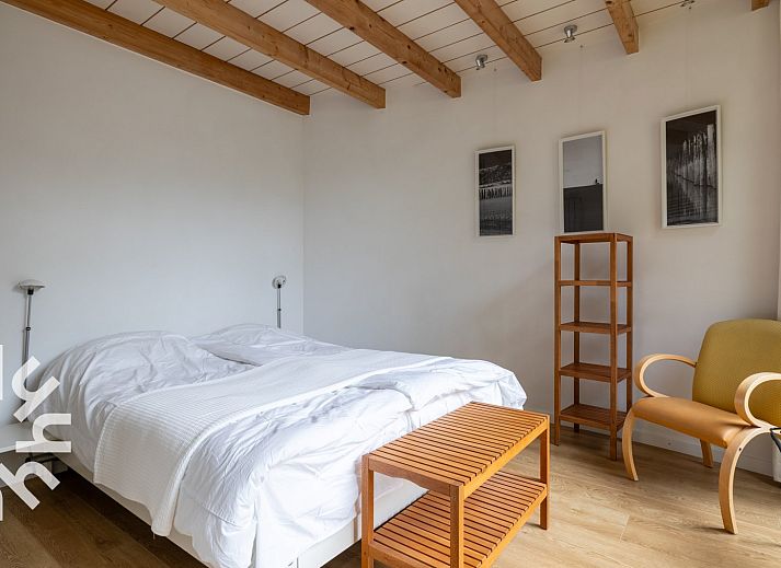 Attractive bedroom in vacation home ZE1302 in Koudekerke, Walcheren with wooden beamed ceiling.