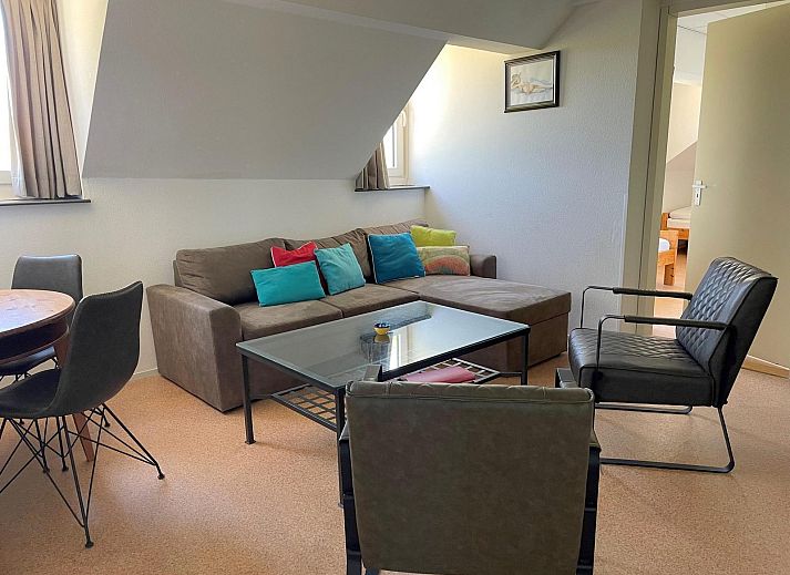 Spacious lawn at VZ034 Apartment Koudekerke, vacation home in Koudekerke, Walcheren, with comfortable chairs in the garden.