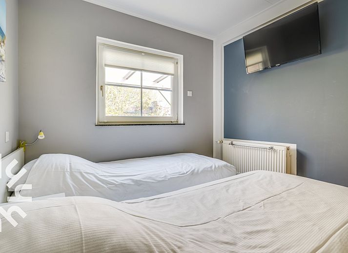 Bedroom with two beds in vacation home ZE742, Oostkapelle, Zeeland.