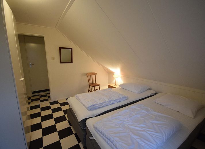 Cozy living room of VZ1157 Detached very spacious vacation home in Oostkapelle with large windows and comfortable sofas.