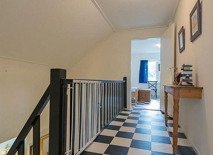 Cozy living room of VZ1157 Detached very spacious vacation home in Oostkapelle with large windows and comfortable sofas.