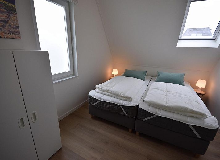 Blick vom Wohnzimmer des Ferienhauses VZ1078 in Oostkapelle auf den Garten.