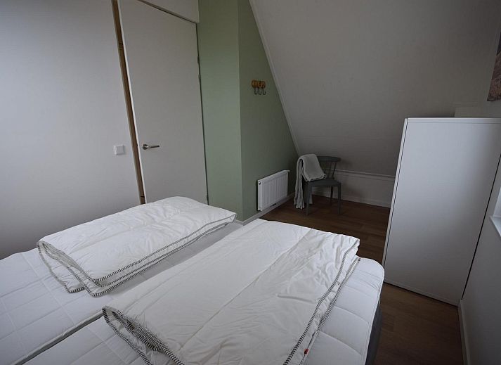 Blick vom Wohnzimmer des Ferienhauses VZ1078 in Oostkapelle auf den Garten.