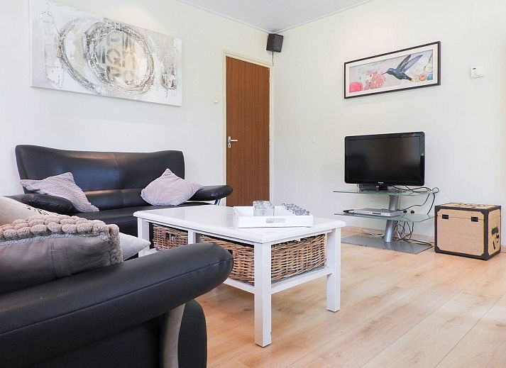 Terrace of VZ073 Holiday bungalow Oostkapelle, Walcheren, Zeeland with garden furniture in sunlight.