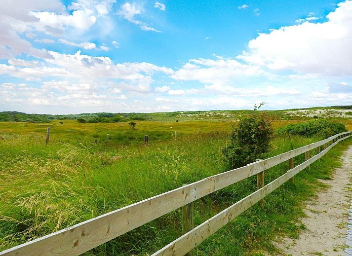 Dining room in VZ073 Holiday bungalow Oostkapelle, Walcheren, Zeeland with garden view.