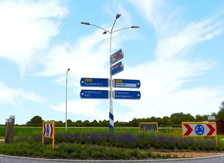 Dining room in VZ073 Holiday bungalow Oostkapelle, Walcheren, Zeeland with garden view.