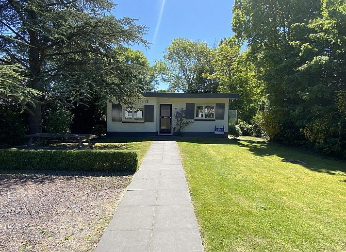 Dining room in VZ073 Holiday bungalow Oostkapelle, Walcheren, Zeeland with garden view.