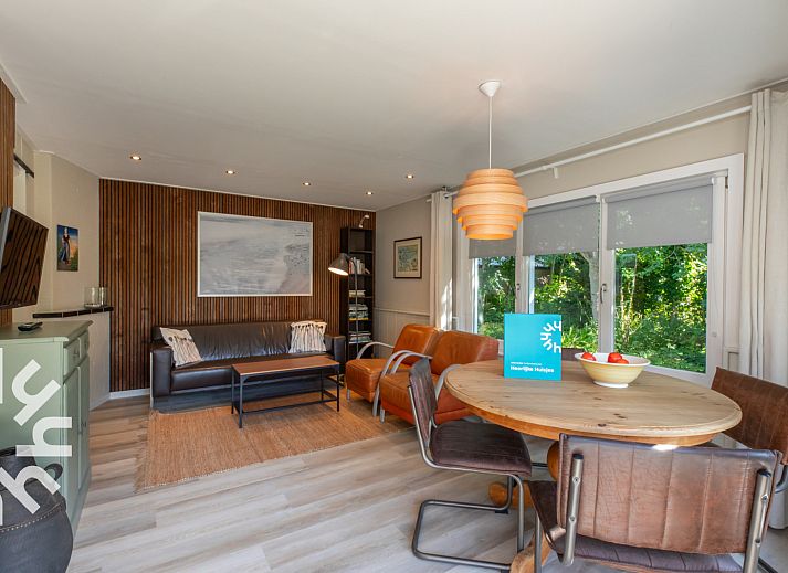 Sunny terrace with deck chairs at vacation home ZE721, Oostkapelle, Walcheren.