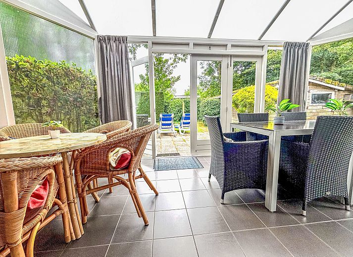 Spacious garden at Apartment Boszicht 1 in Oostkapelle, Walcheren, with deck chairs and green views.