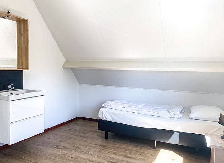 Gezellige woonkamer van Vakantiehuisje in Oostkapelle, Walcheren, met comfortabele zithoek.