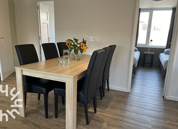 Spacious living room in vacation home ZE927, Westkapelle, with kitchen and comfortable seating.