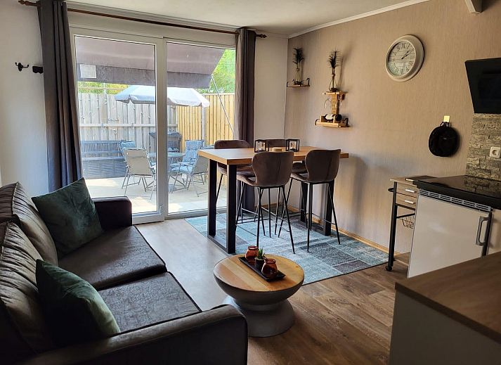 Cozy terrace at VZ2343 Holiday home Westkapelle in Zeeland, ideal for outdoor dining.