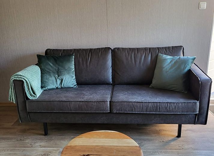 Cozy terrace at VZ2343 Holiday home Westkapelle in Zeeland, ideal for outdoor dining.