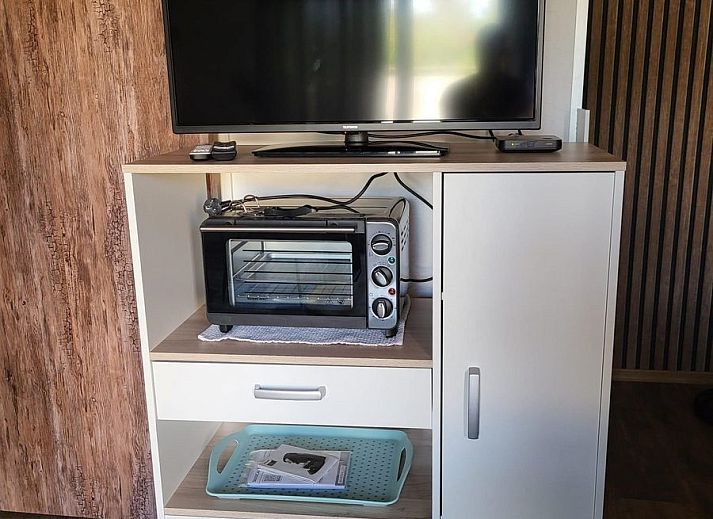 Modern living room of VZ2343 Holiday cottage Westkapelle with comfortable sofa in Walcheren.