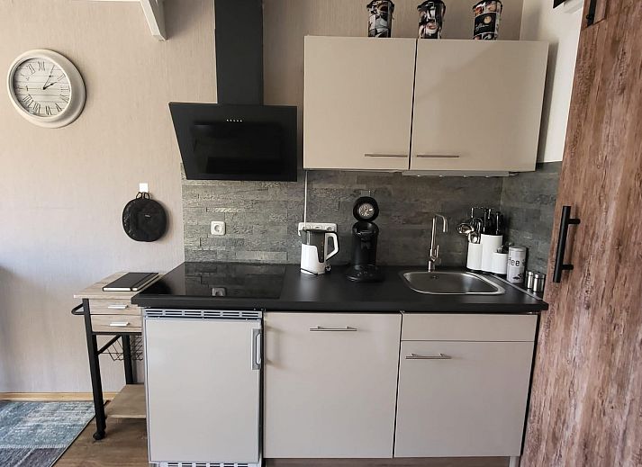 Modern living room of VZ2343 Holiday cottage Westkapelle with comfortable sofa in Walcheren.