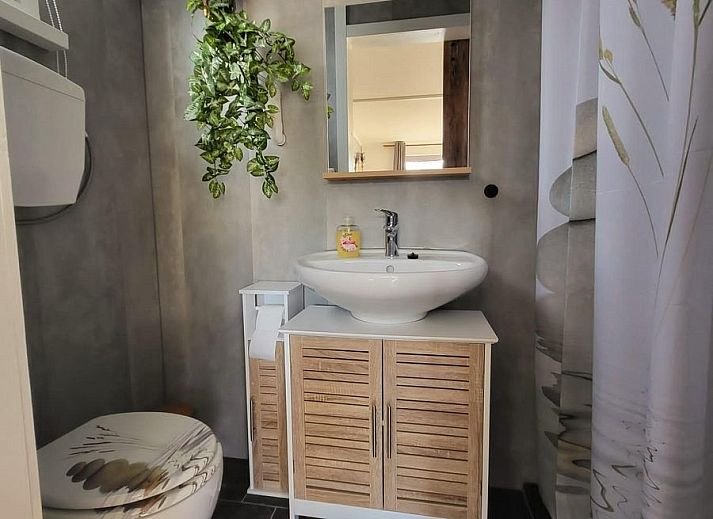 Dining area in VZ2343 Holiday home Westkapelle, perfect for cozy meals in Zeeland.