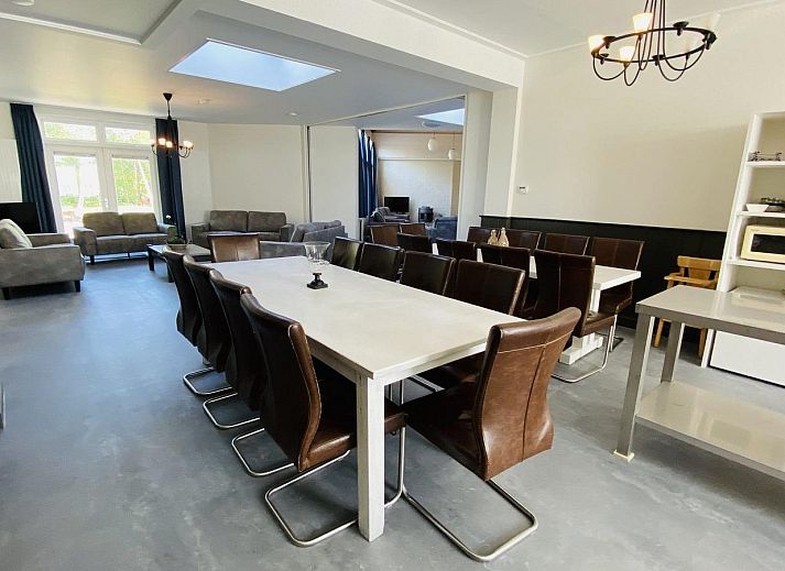 Terrace with picnic tables at VZ131 Group accommodation Westkapelle, vacation home in Zeeland.