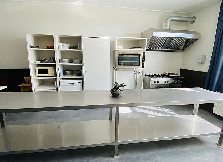 Terrace with picnic tables at VZ131 Group accommodation Westkapelle, vacation home in Zeeland.