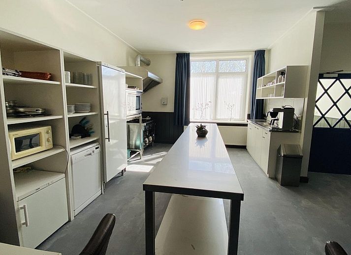 Terrace with picnic tables at VZ131 Group accommodation Westkapelle, vacation home in Zeeland.