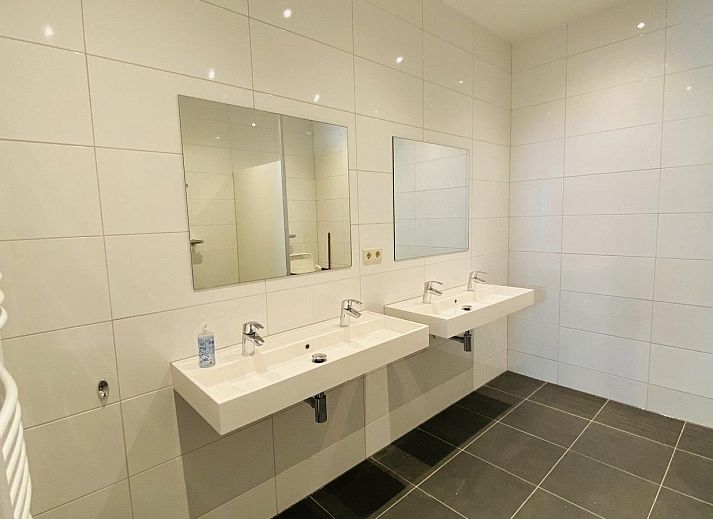 Terrace with picnic tables at VZ131 Group accommodation Westkapelle, vacation home in Zeeland.