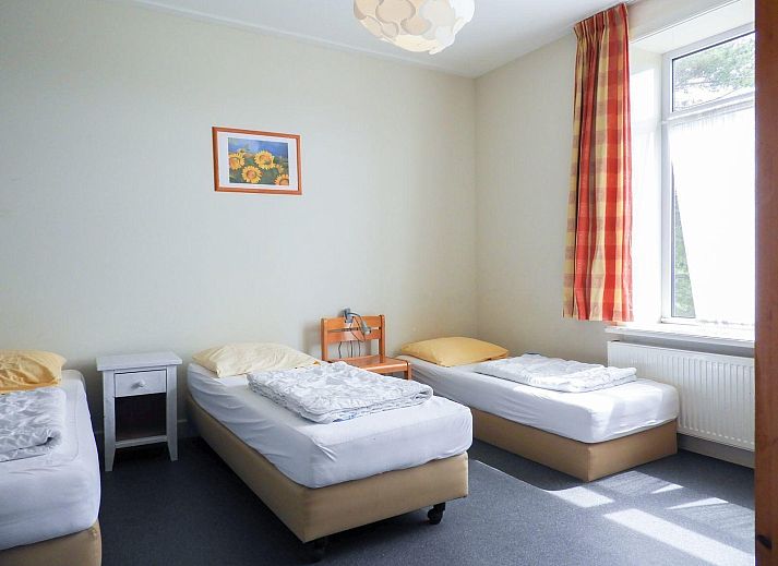 Side view of VZ131 Group accommodation Westkapelle, vacation home surrounded by greenery in Walcheren.