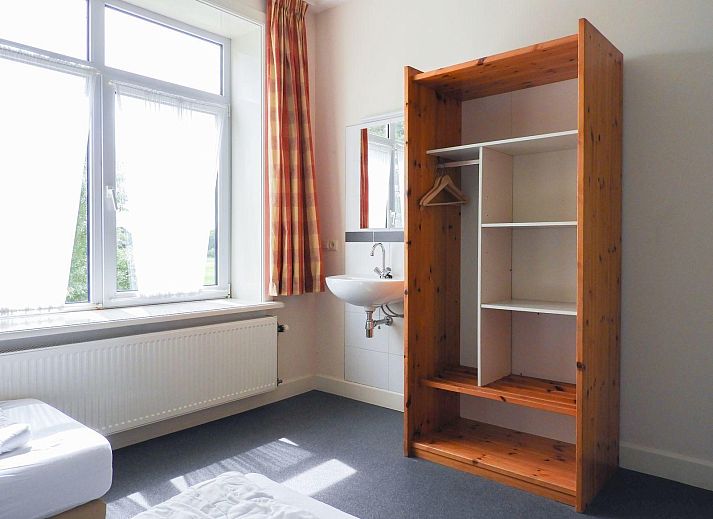 Side view of VZ131 Group accommodation Westkapelle, vacation home surrounded by greenery in Walcheren.