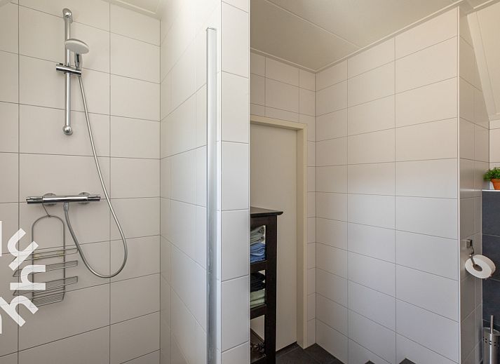 Comfortabele zithoek in vakantiehuis ZE1489, gelegen in Domburg, Walcheren, met uitzicht op de tuin.